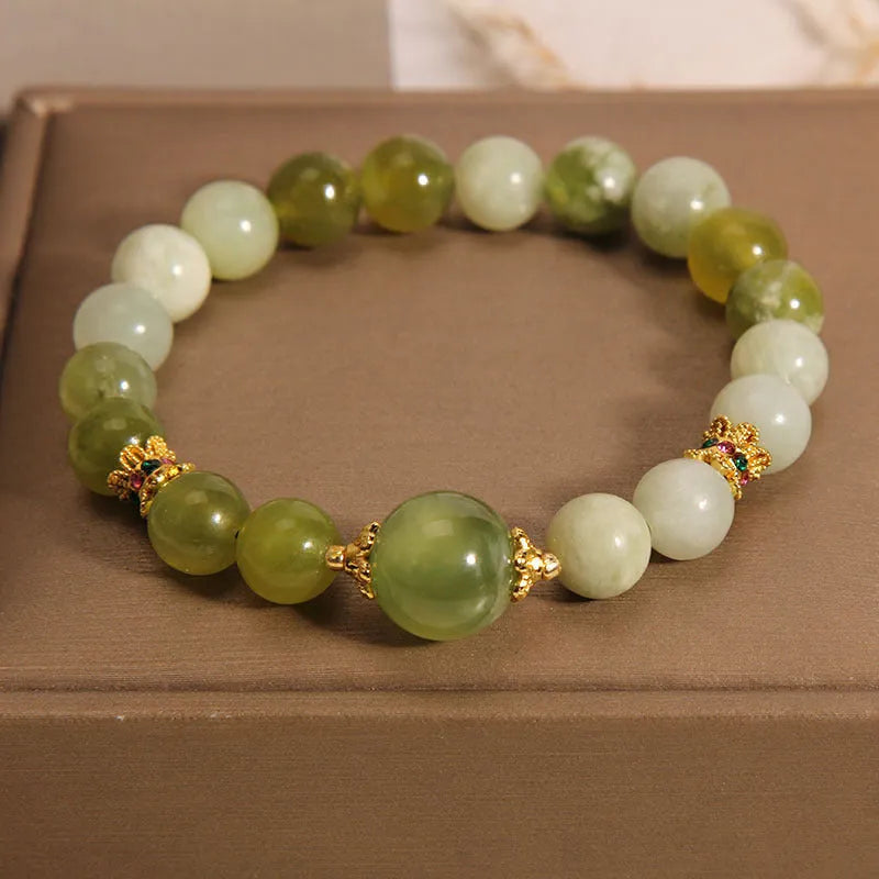 Xiuyan jade women's bracelet in jade green colour with natural stone patterns and Mori-style design