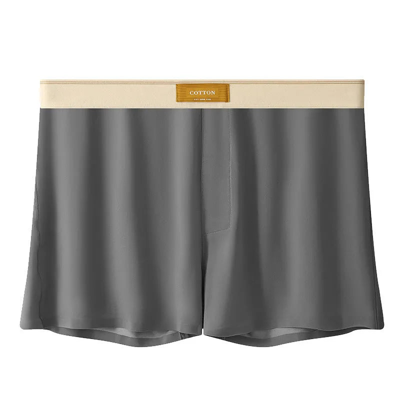 Pack of three men's solid colour loose fit ice silk underwear briefs on a grey background.