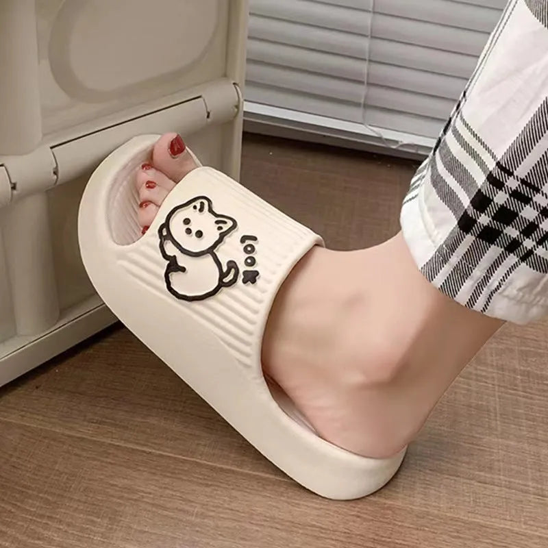 Green EVA cat flip-flop slippers with a thick platform sole on a white background.