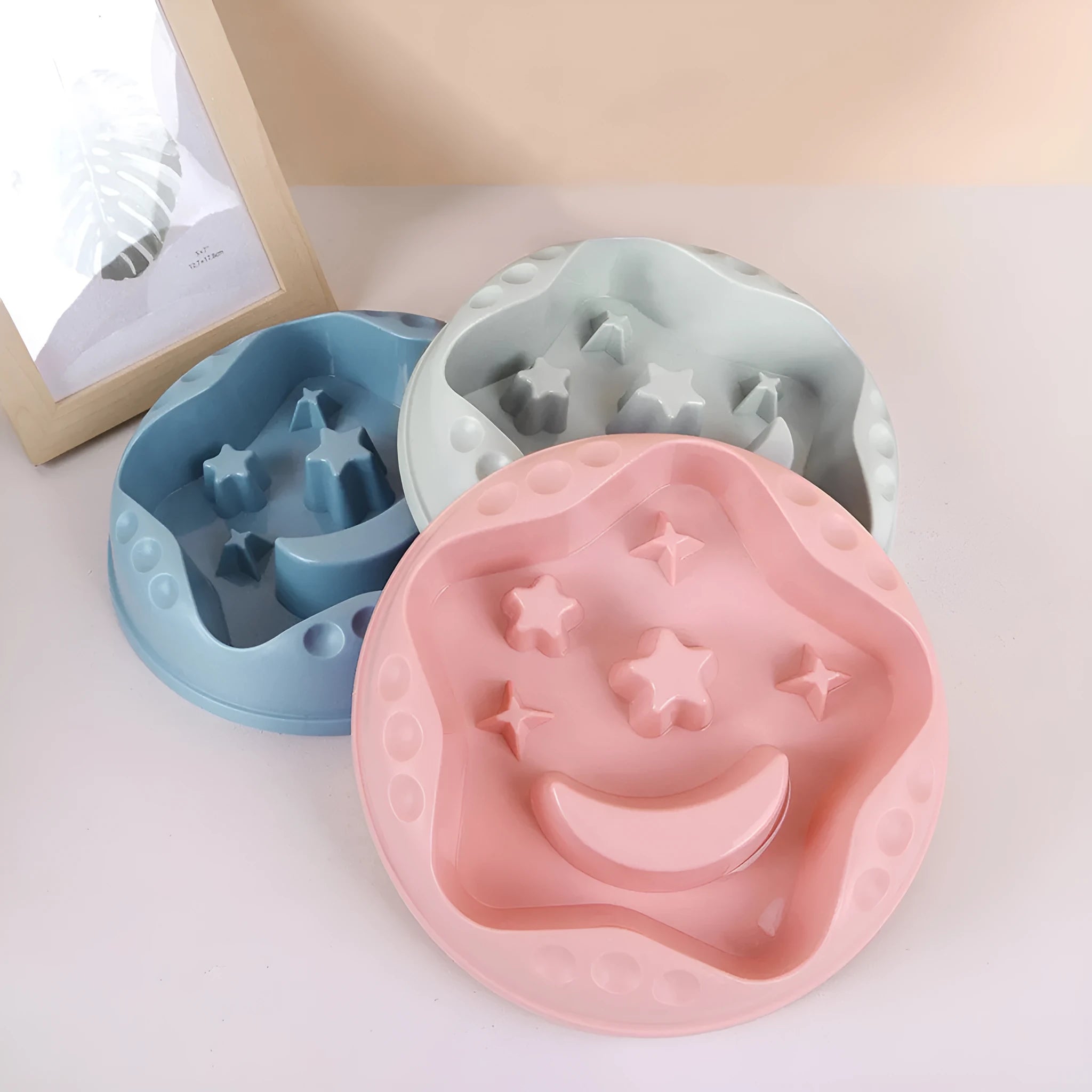 Blue star and wings design large plastic slow feeder dog bowl with maze pattern.