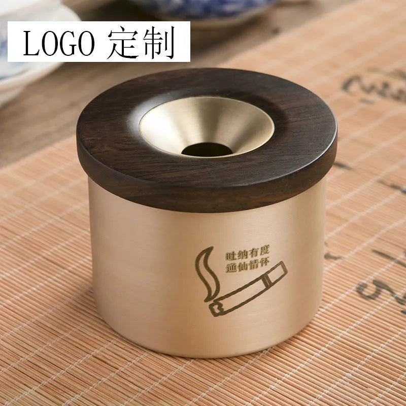 Retro brass ashtray with wooden lid showing copper construction and central hole design
