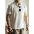 American-style short-sleeve polo shirt in blue, black, or white cotton-polyester blend.