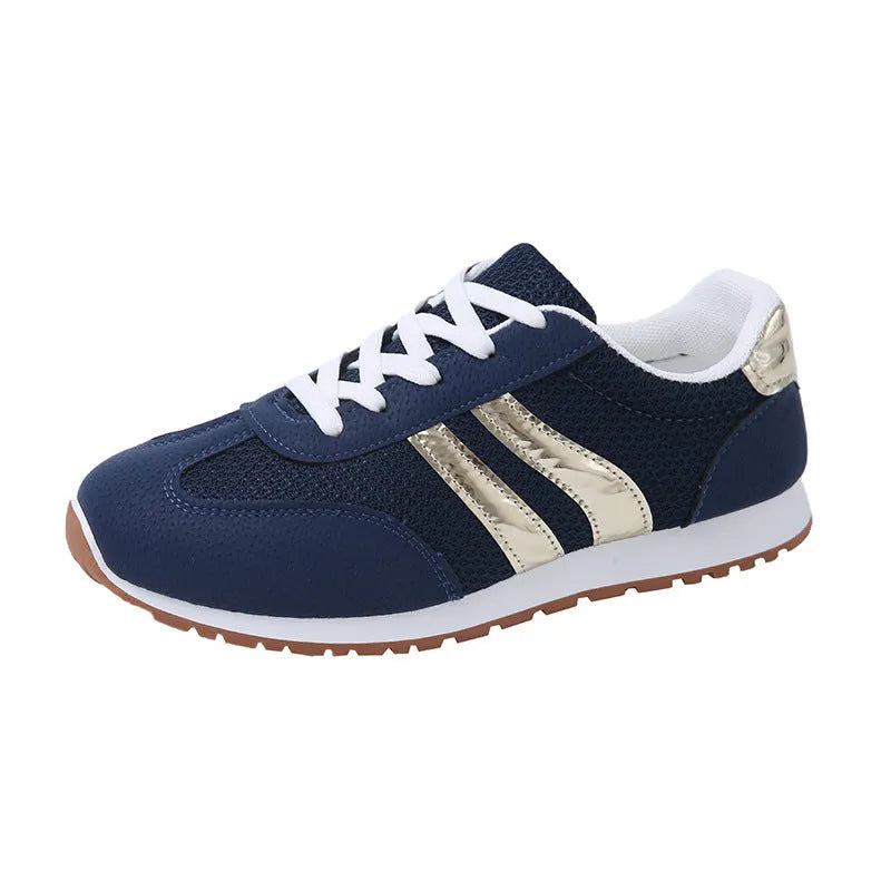 Light blue women's tennis shoes with cross shoulder straps and white rubber soles