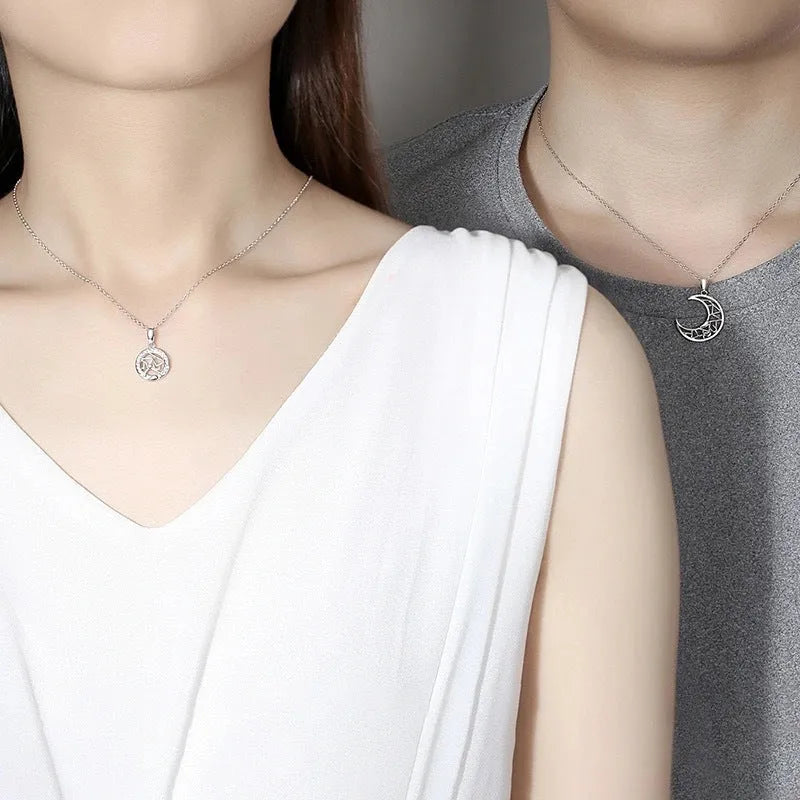 Sun Moon couple necklace set with copper electroplated pendants on a cross chain.