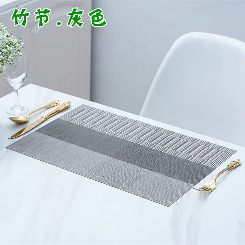 PVC non-slip dish mat in gradient bamboo design protecting kitchen worktop with dishes