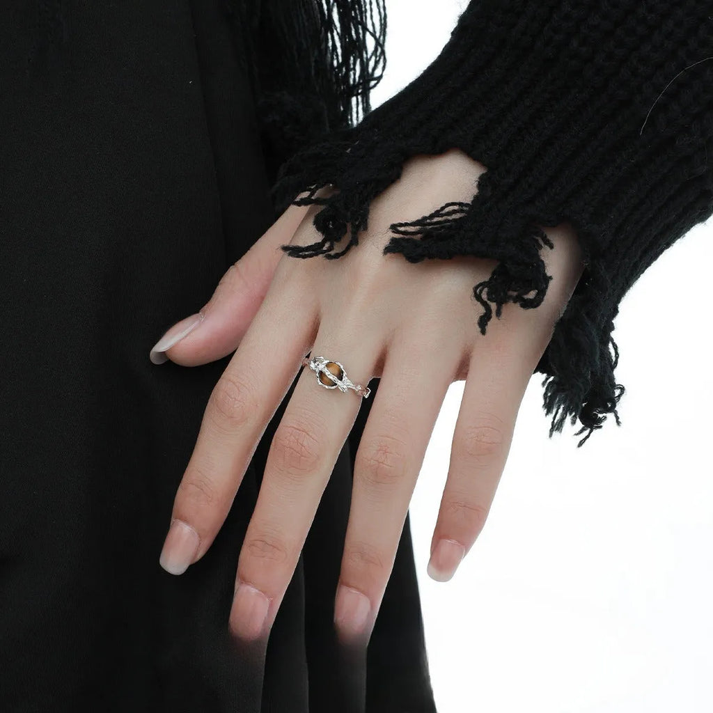 White gold coloured Saturn open ring with adjustable sizing on silver base