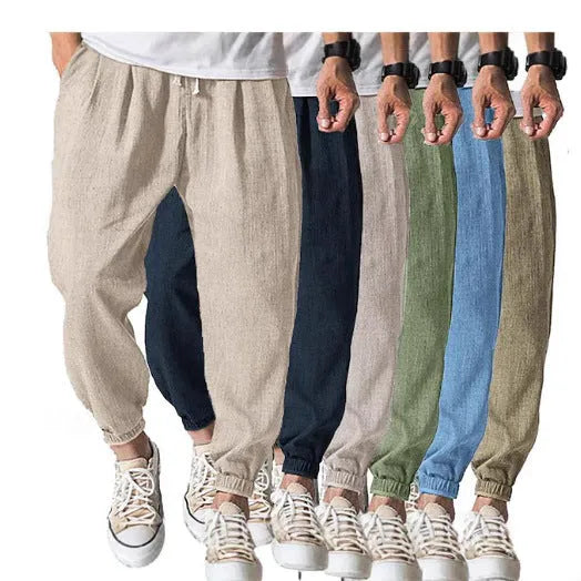 Men's loose casual cotton trousers with an elasticated ankle band in light green.