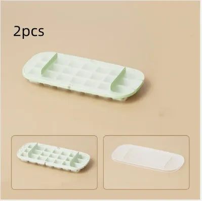Blue food-grade plastic ice cube tray with grid design and integrated ice shovel storage.