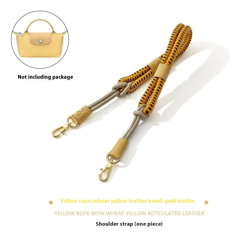 Braided nylon and cowhide leather crossbody shoulder strap with gold alloy buckle on a grey background.