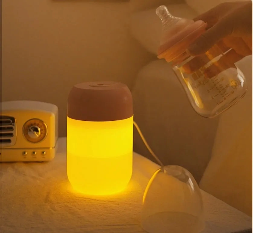 White cylindrical USB-powered humidifier with aromatherapy function on desk
