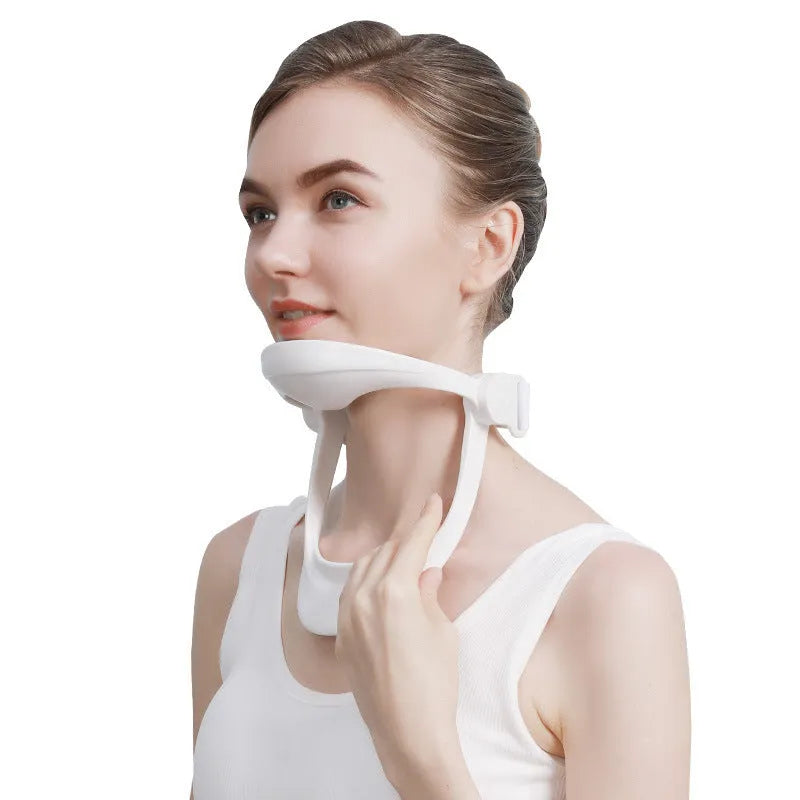 White PP plastic neck brace for cervical spine support on a neutral background.