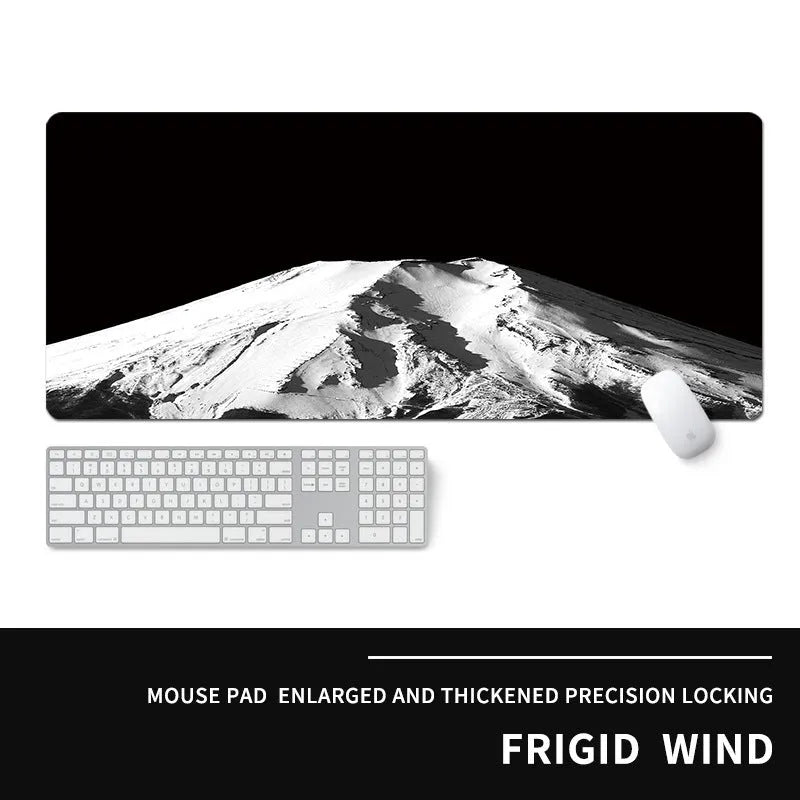 Oversized natural rubber gaming desk mat with graphical print, showing keyboard and mouse placement.