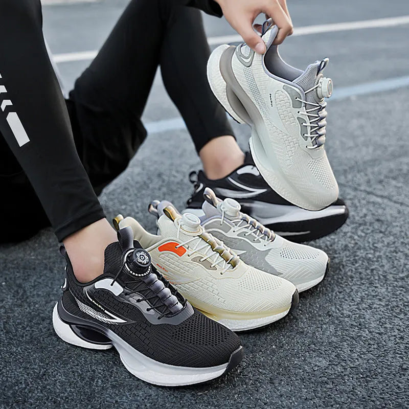 White low-top running shoes with a rotating buckle closure and Fly-knit mesh upper.