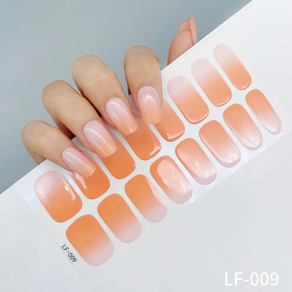 Set of 16 solid colour nail art stickers showing floral, geometric, and pattern designs for manicure application
