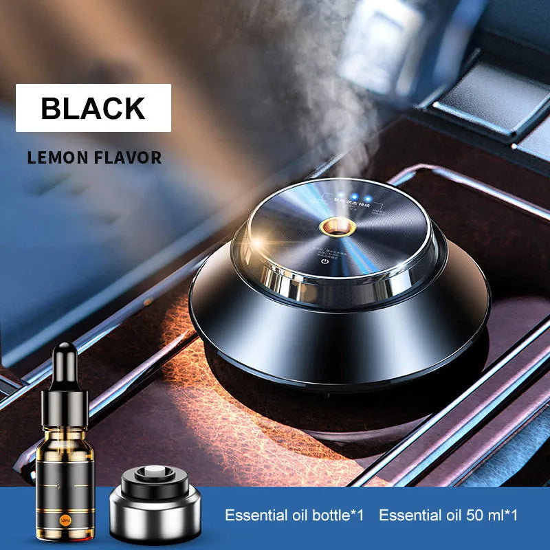 Black butterfly-shaped metal car aromatherapy air purifier with USB cable and essential oil bottle.