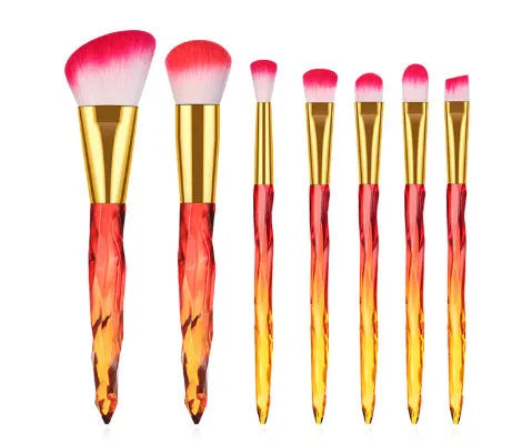 Set of 10 crystal-handled foundation brushes with synthetic bristles laid out flat.