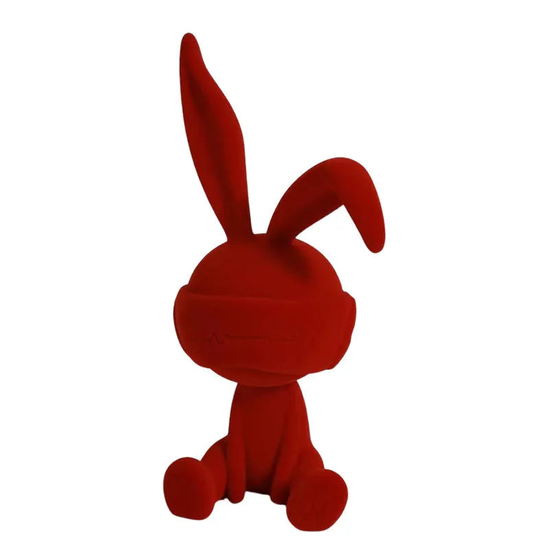 Small resin rabbit table ornament with a suede blindfold, shown in green, blue, and red colour options.