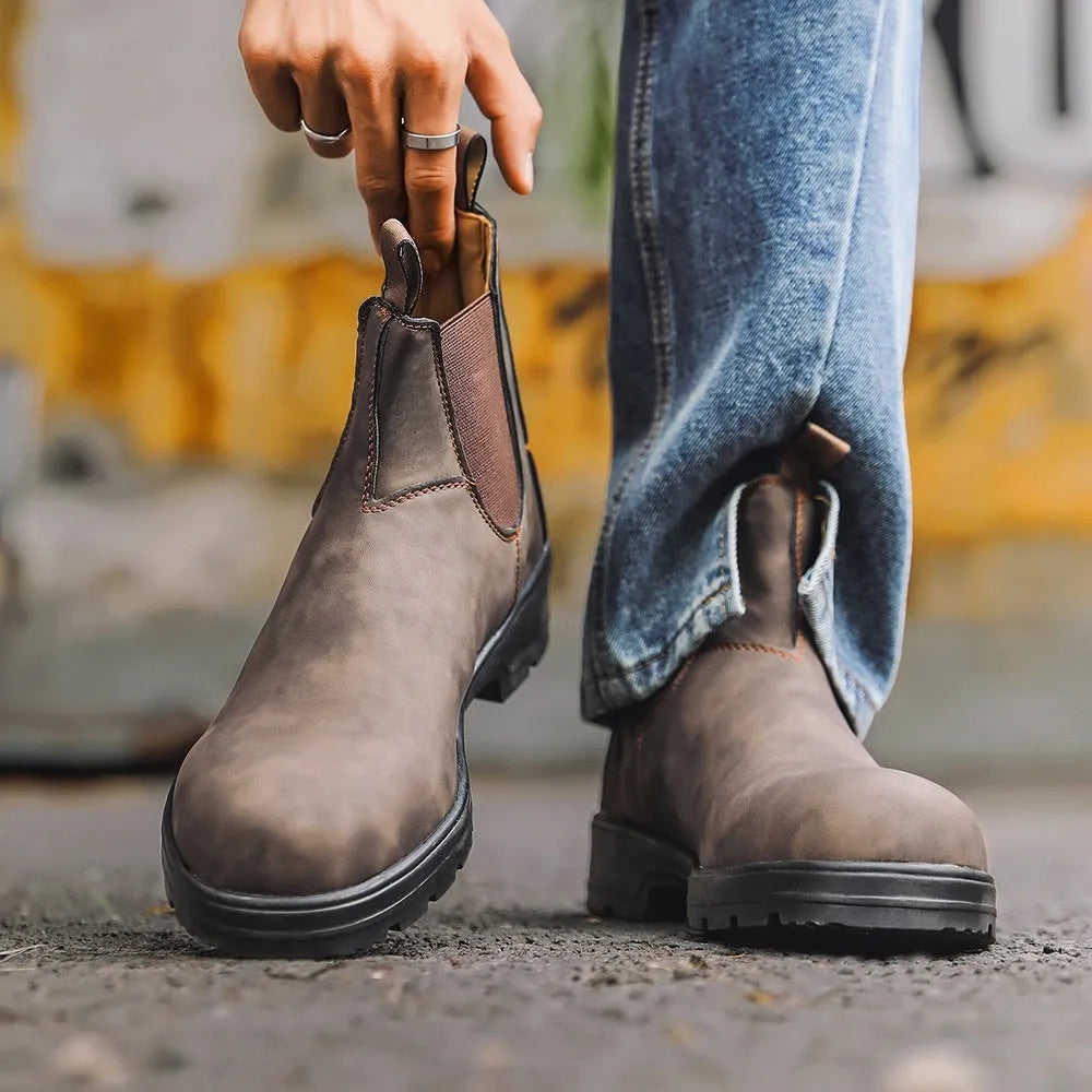 Vintage-style unisex Chelsea boot in frosted brown PU with car suture detail and a low horseshoe heel.