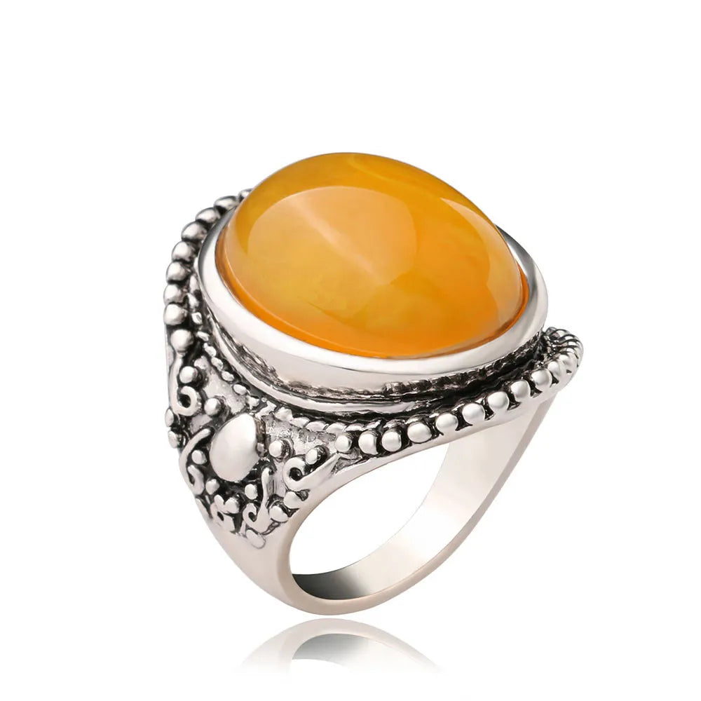 Retro geometric alloy ring with fluorescent beeswax centre and antique silver electroplated finish