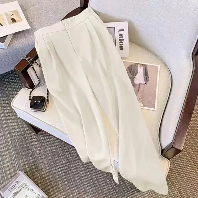 Women's loose fit polyester blouse in multiple colours with regular sleeves and 50cm length