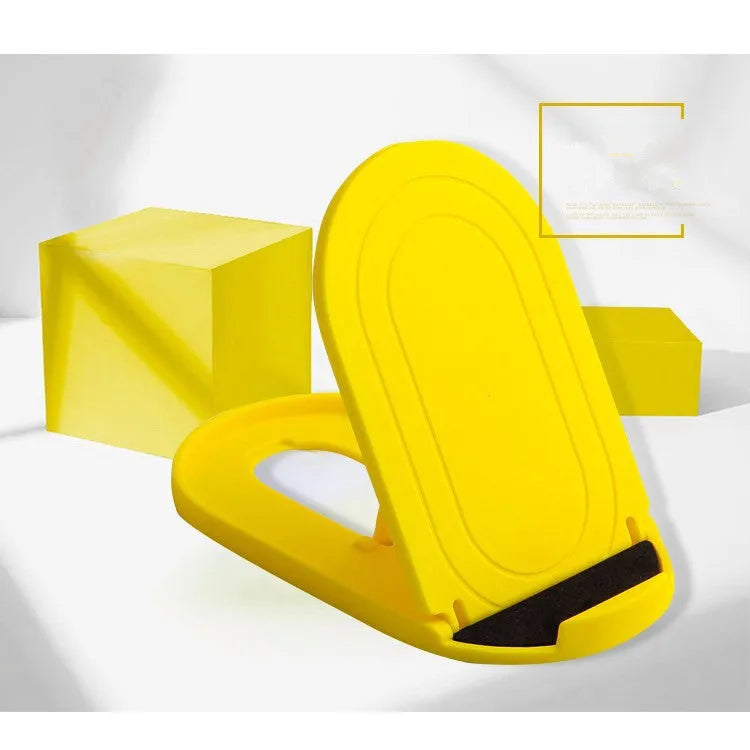 Plastic mobile phone stand with adjustable bracket in six colour options on a wooden desk