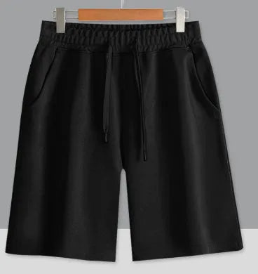 Cotton micro-elastic sports shorts in straight cut fifth length design on hanger