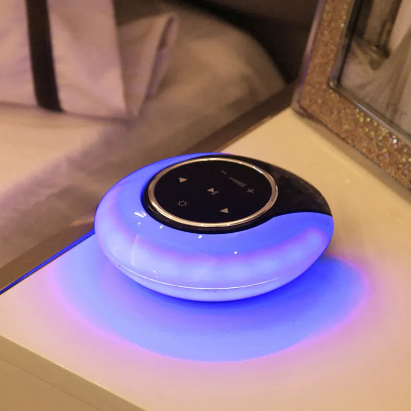 Blue Bluetooth speaker LED desk lamp with touch controls and folding design on wooden desktop