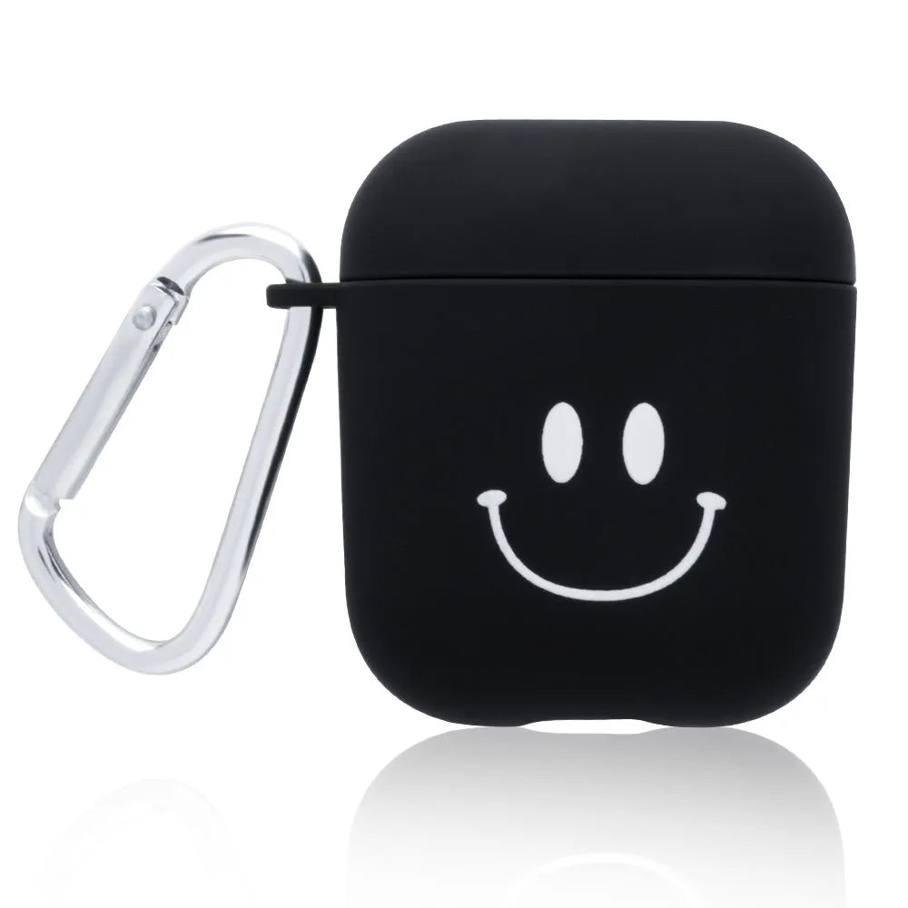 Black and pink AirPods case covers with floral and smiley face decorative patterns