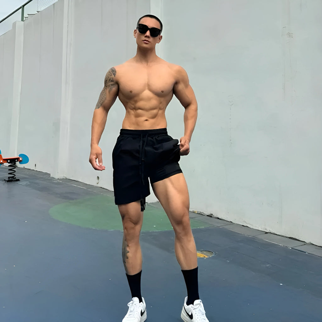 Man wearing grey ice silk quick-drying double-layer quarter shorts on a casual day out.