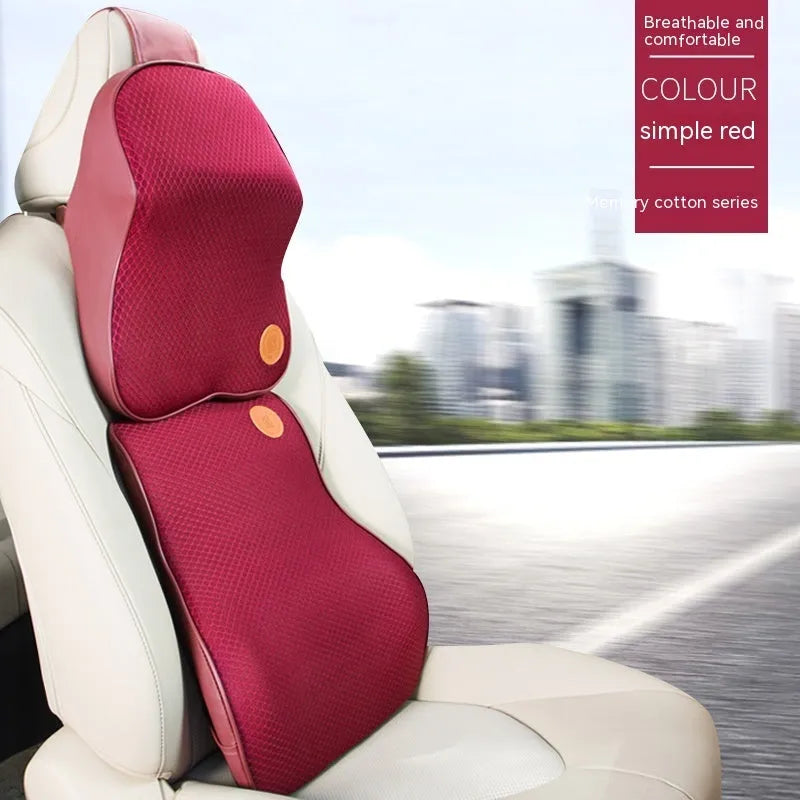 Black and brown memory foam car headrest and lumbar support pillows on a car seat.