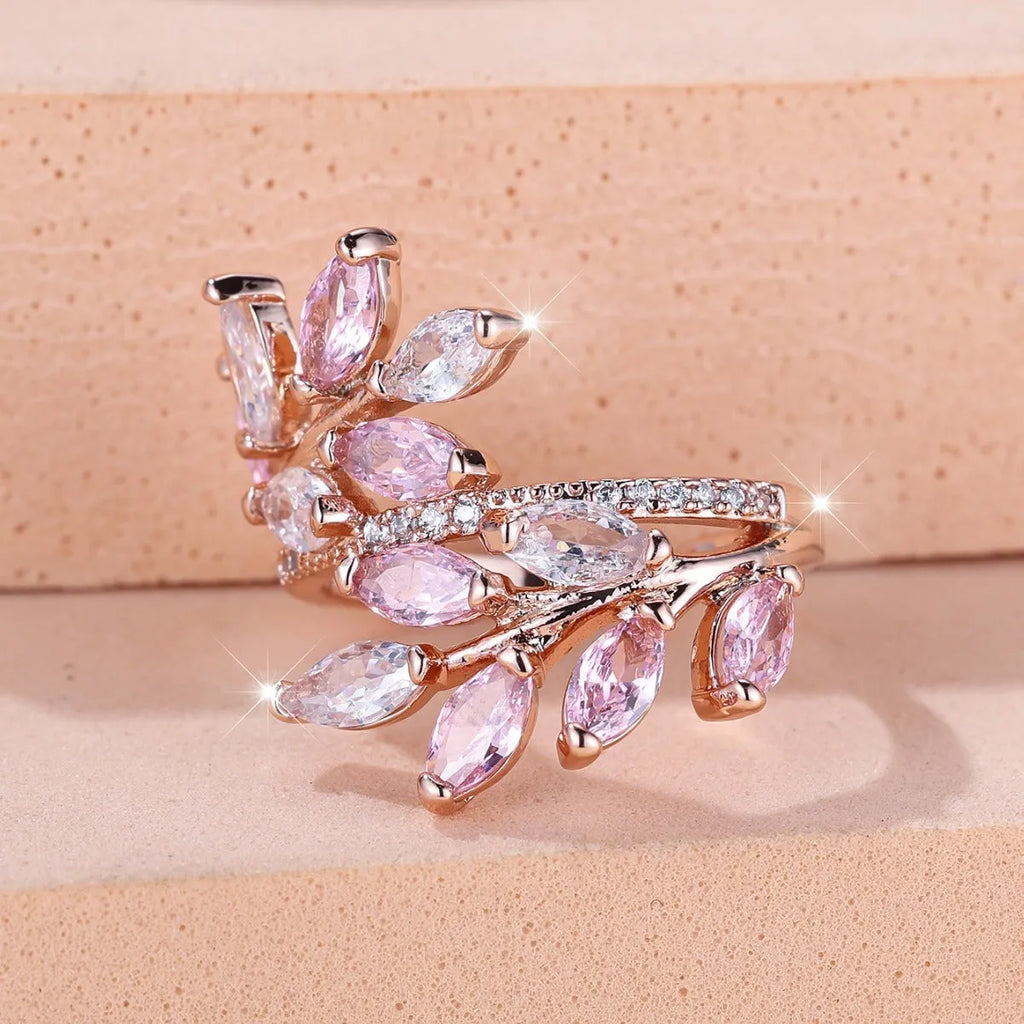 Adjustable horse eye zircon leaf ring in copper on a hand, showing leaf detail and colour options.