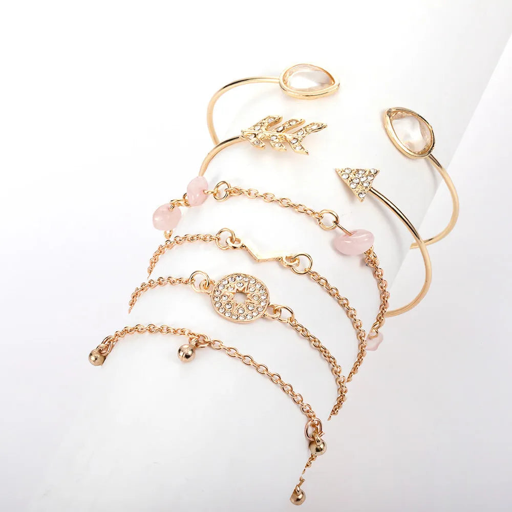 Golden spot drill charm bracelet set with arrow and water drop shapes