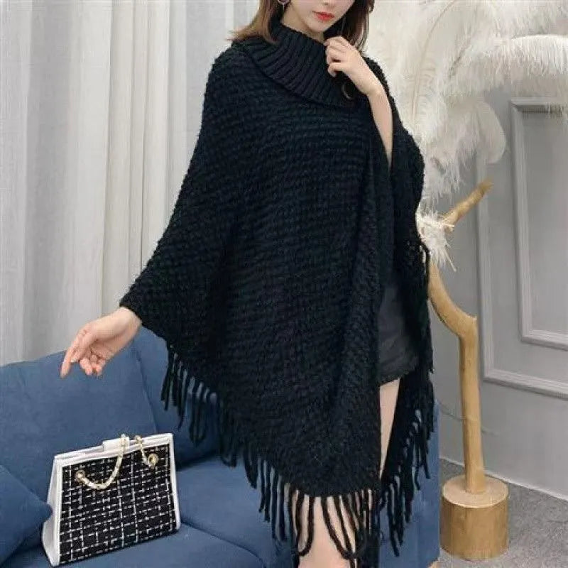 Women's plush cashmere blend triangle shawl cape with tassel trim in multiple colour options.
