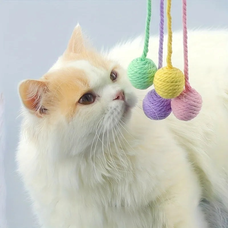 Colourful cat toy ball with rope handle and built-in bell for interactive play