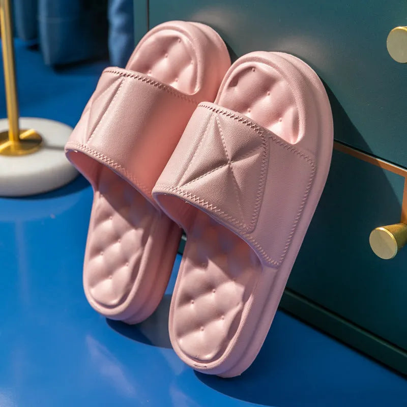 A pair of thick-soled EVA bathroom slippers in a selected colour, showing the non-slip sole pattern.