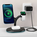 Black three-in-one magnetic wireless charger with ABS plastic casing on a desk.