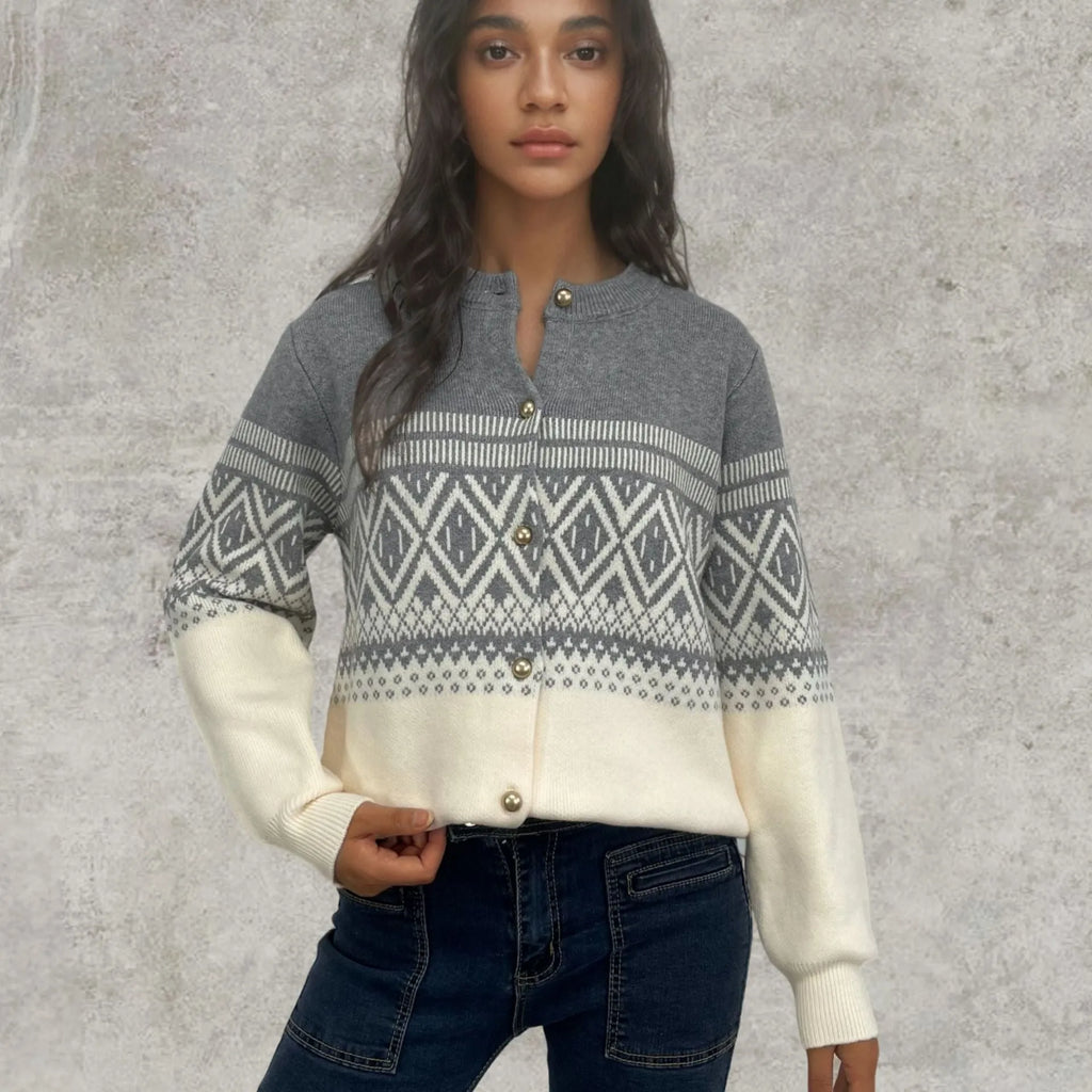 Women's grey alpaca wool cardigan with long sleeves and a red diamond contrast knit pattern.