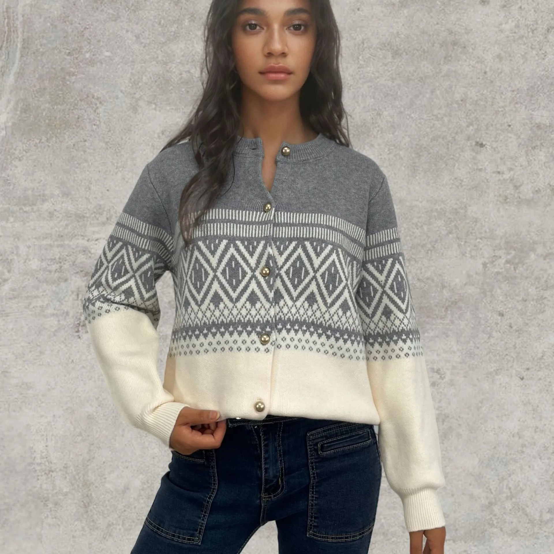 Women's grey alpaca wool cardigan with long sleeves and a red diamond contrast knit pattern.