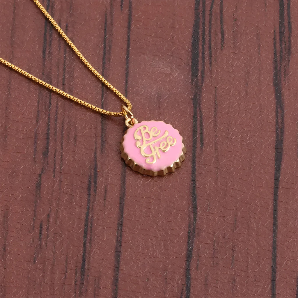 Copper bottle cap pendant necklace with gold plating on a box chain.