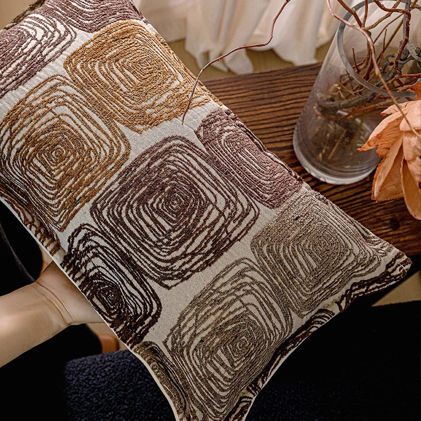 Abstract coil pattern pillow cover in cream and coffee colours showing square and rectangular size options