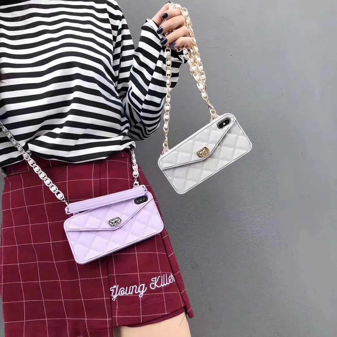 Beige silicone iPhone back cover case with a silver pearl chain lanyard attached