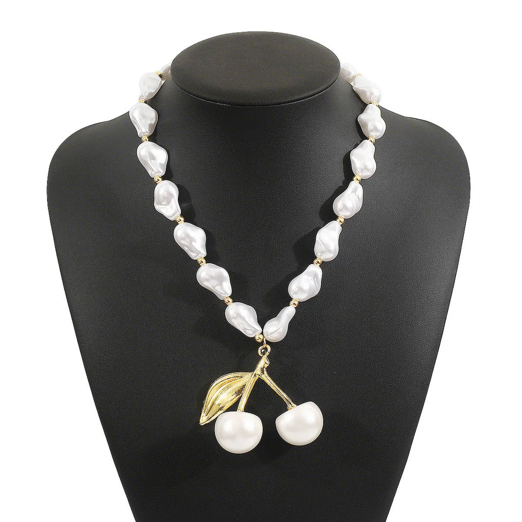 Gold geometric cherry fruit pendant on imitation pearl chain necklace for women