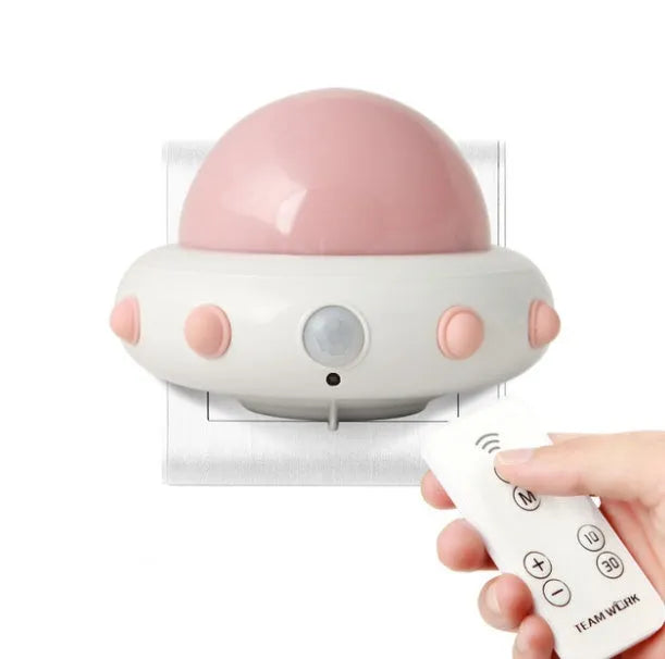 Blue remote control UFO shaped bedside night light with dimensions 105mm by 76mm by 58mm