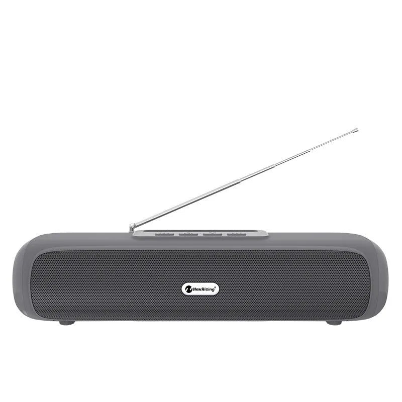 Long strip wireless desktop speaker in black on a desk