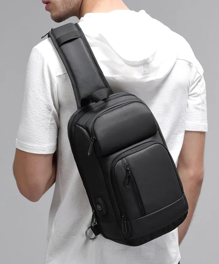 Black PVC outdoor shoulder bag with air cushion strap and multiple compartments