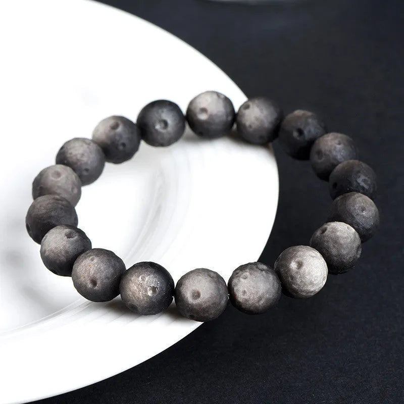 Obsidian crater ball bracelet with textured beads in silver stone or golden meteorite finish