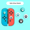 Four silicone rocker caps for Nintendo Switch Joy-Con controllers in assorted colours on a grey background.