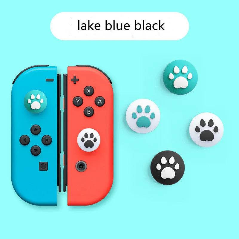 Four silicone rocker caps for Nintendo Switch Joy-Con controllers in assorted colours on a grey background.