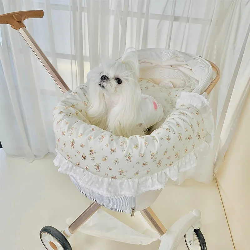 Pet stroller three-piece cushion set with removable cloth towel, pillow and pad in floral pattern.