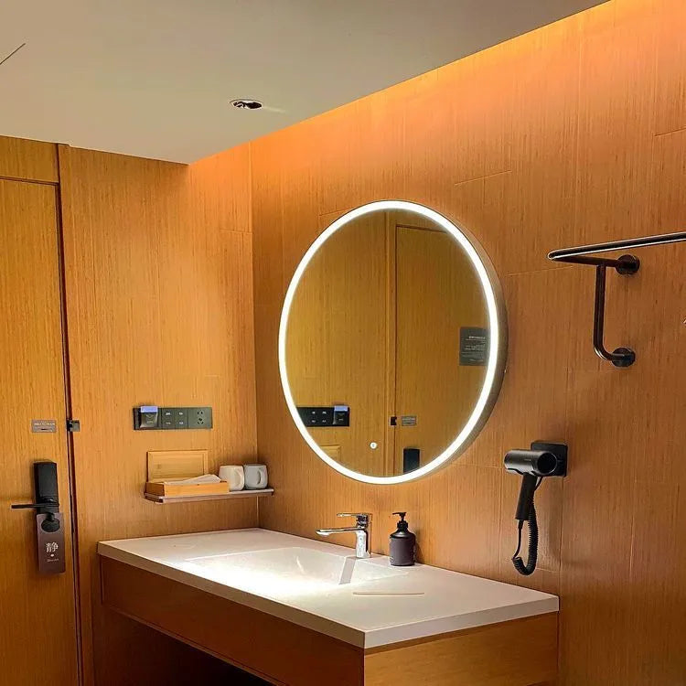 Round black aluminium frame smart LED bathroom mirror with touch dimming control on wall.